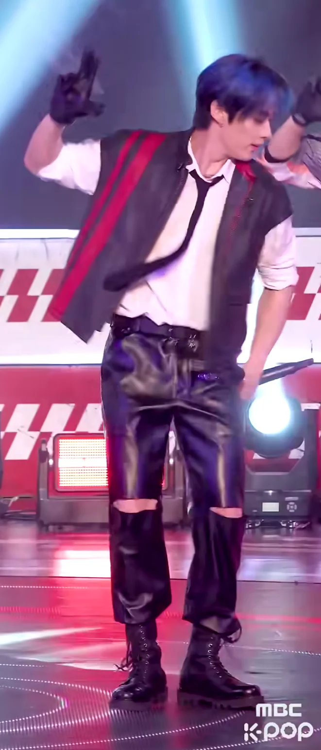 Bold Black and Red Vest with Leather Pants and Combat Boots for Edgy Stage Style