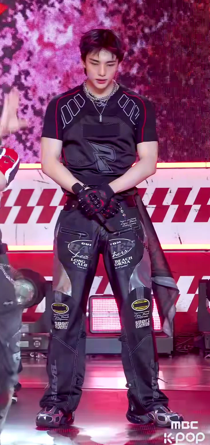 Futuristic Black Top with Graphic Detailing and Reflective Fashion Pants