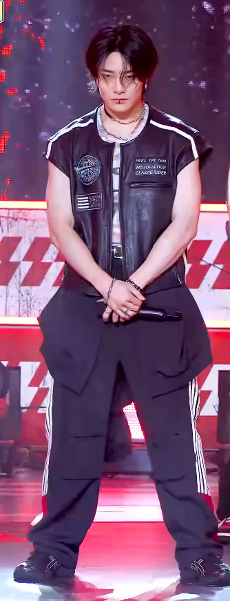 Edgy Punk-Inspired Outfit with Black Leather Vest and Sporty Cargo Pants