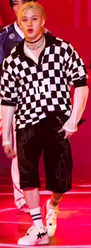 Bold Checkered Pullover and Black Shorts with Edgy Accessories