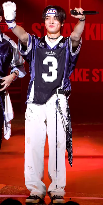 Urban Sports Streetwear Style with Navy Jersey and Distressed White Pants