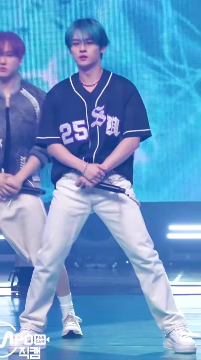 Sporty Black and White Ensemble with Baseball Jersey and White Jeans