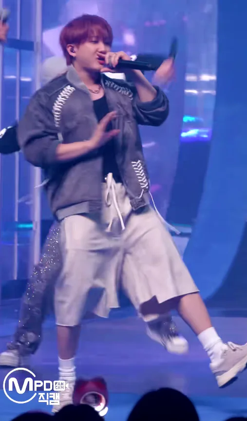 Casual Streetwear Vibes: Grey Jacket with Striking Detail and Cream Shorts