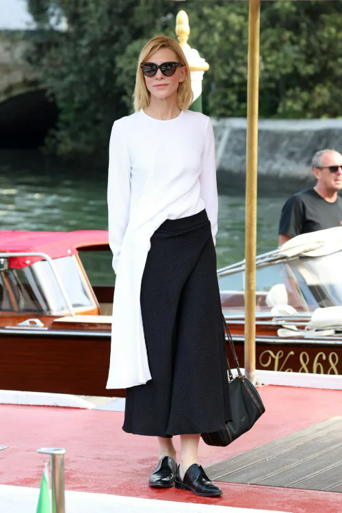 Monochrome Elegance with an Asymmetrical Twist: White and Black Ensemble with Loafers