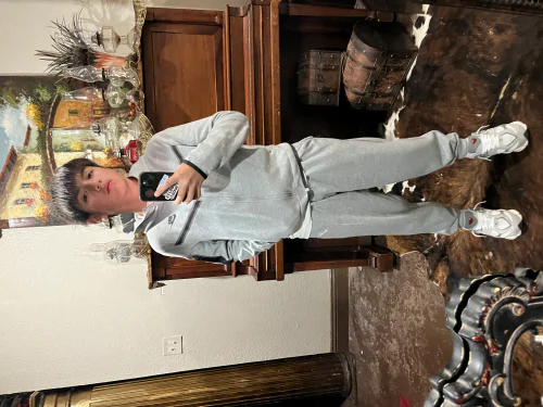 Classic Grey Tracksuit with White Sneakers for a Casual Sporty Look