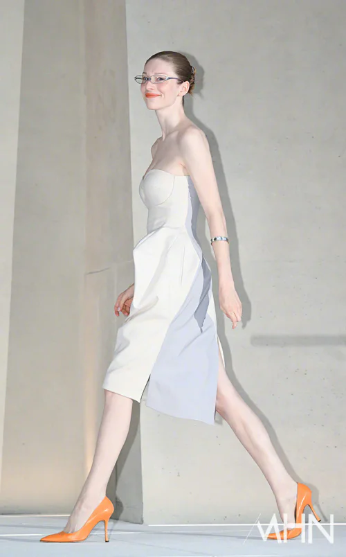 Elegant Asymmetrical Strapless Dress with Bold Orange Pumps