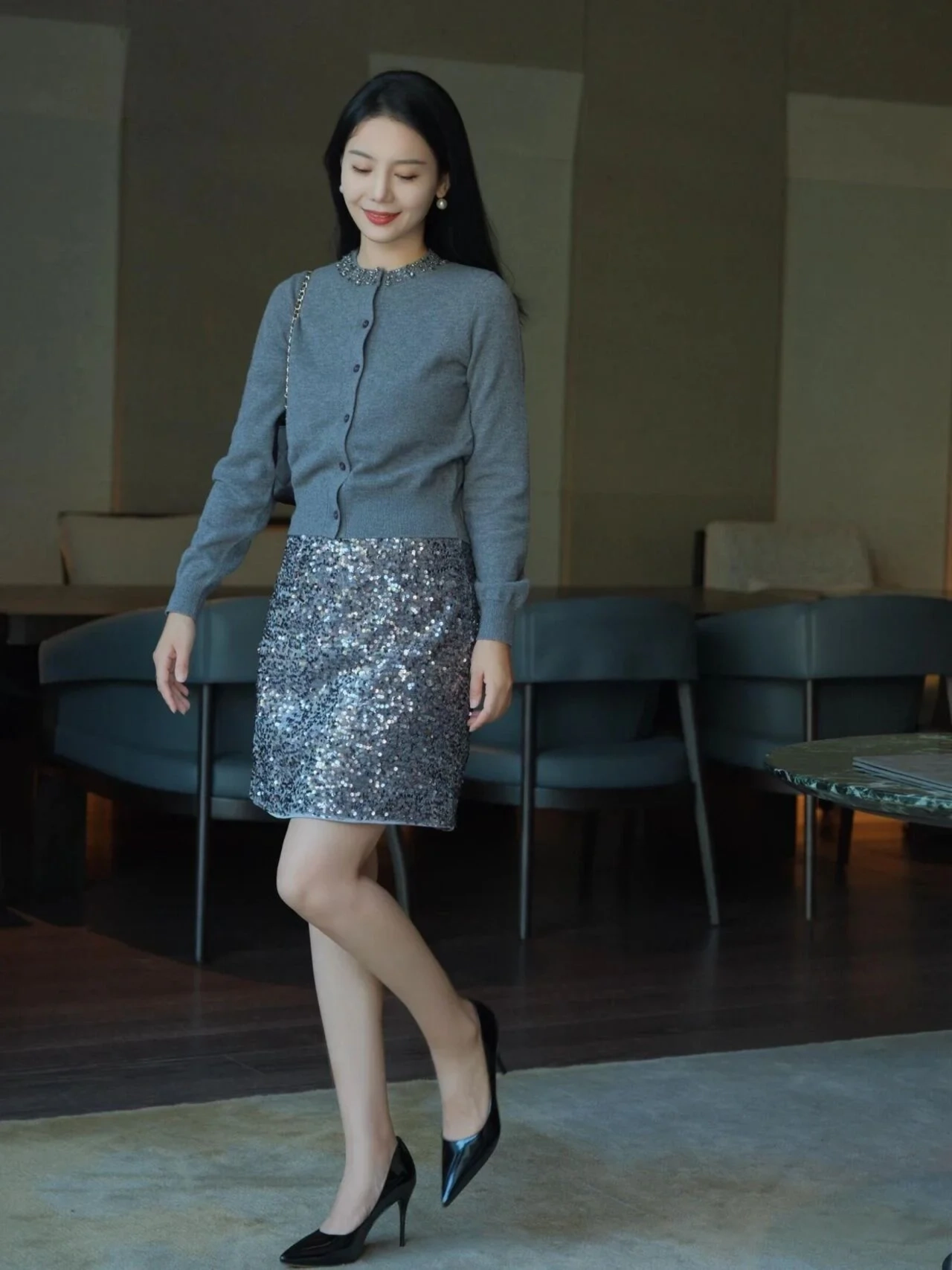 Elegant Grey Cardigan and Sparkling Sequin Skirt with Classic Heels