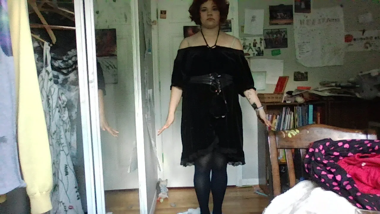 Off-the-shoulder Black Dress with Waist Belt and Tights for a Chic Look
