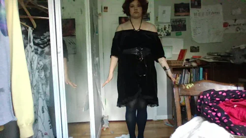 Off-the-shoulder Black Dress with Waist Belt and Tights for a Chic Look