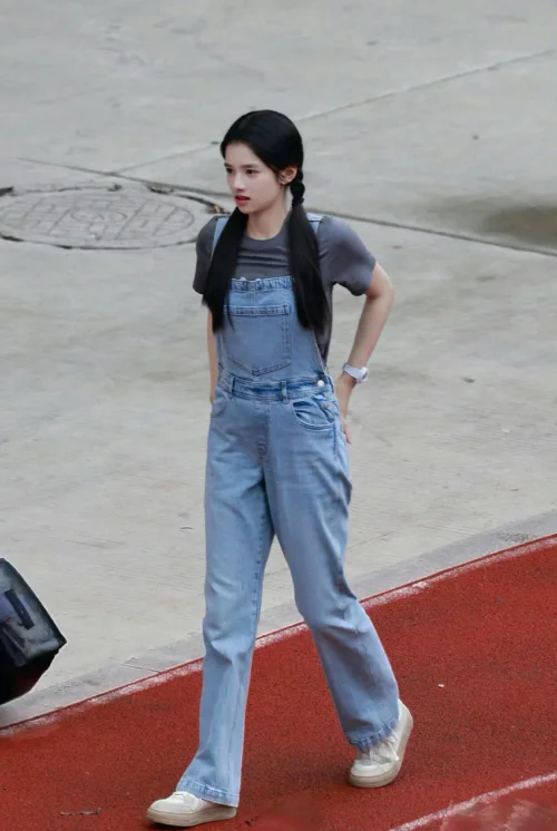 Casual Chic: Denim Overalls with Grey Tee and White Sneakers
