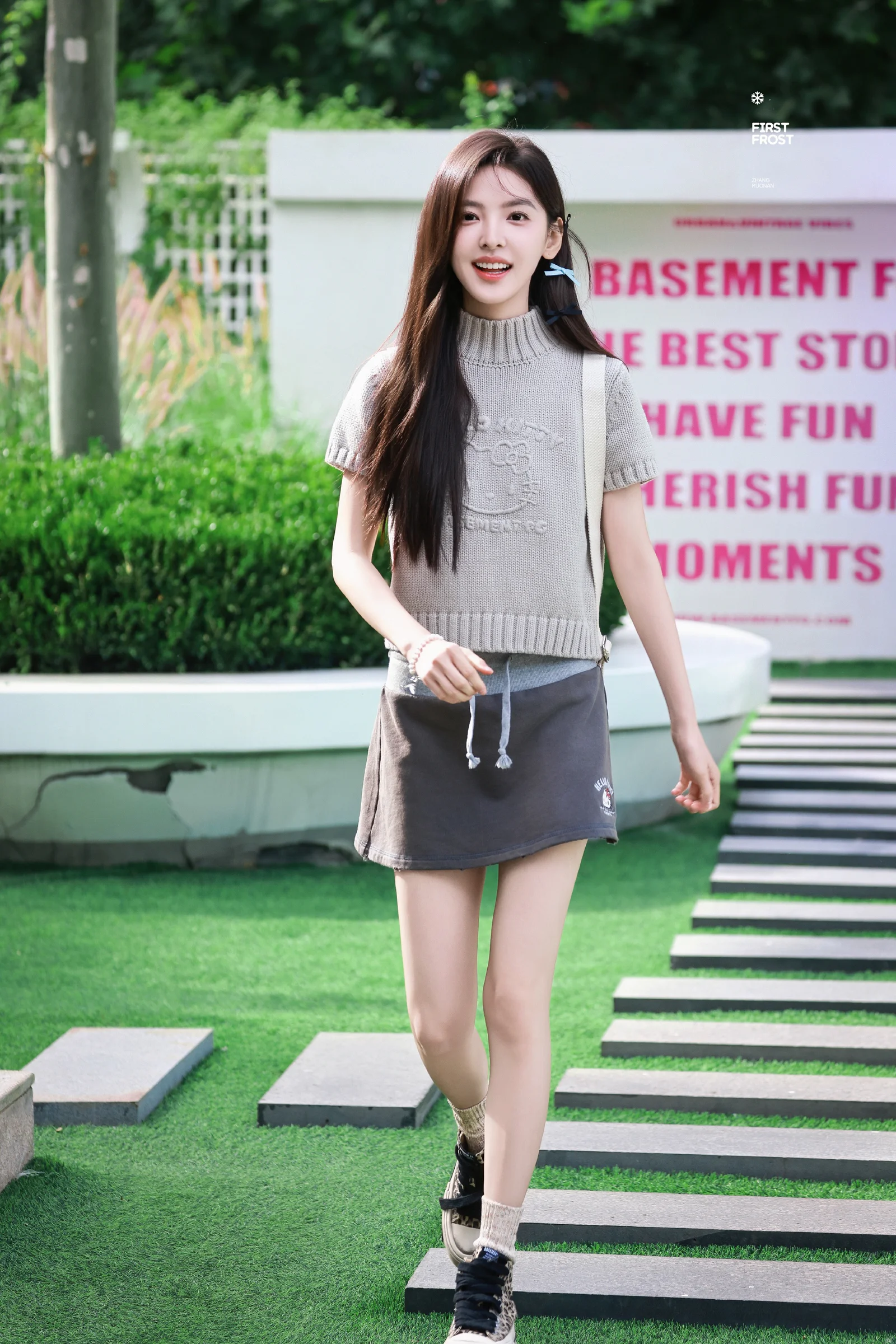 Cozy Casual Chic: Gray Knit Sweater with a Sporty Mini Skirt and Sneakers