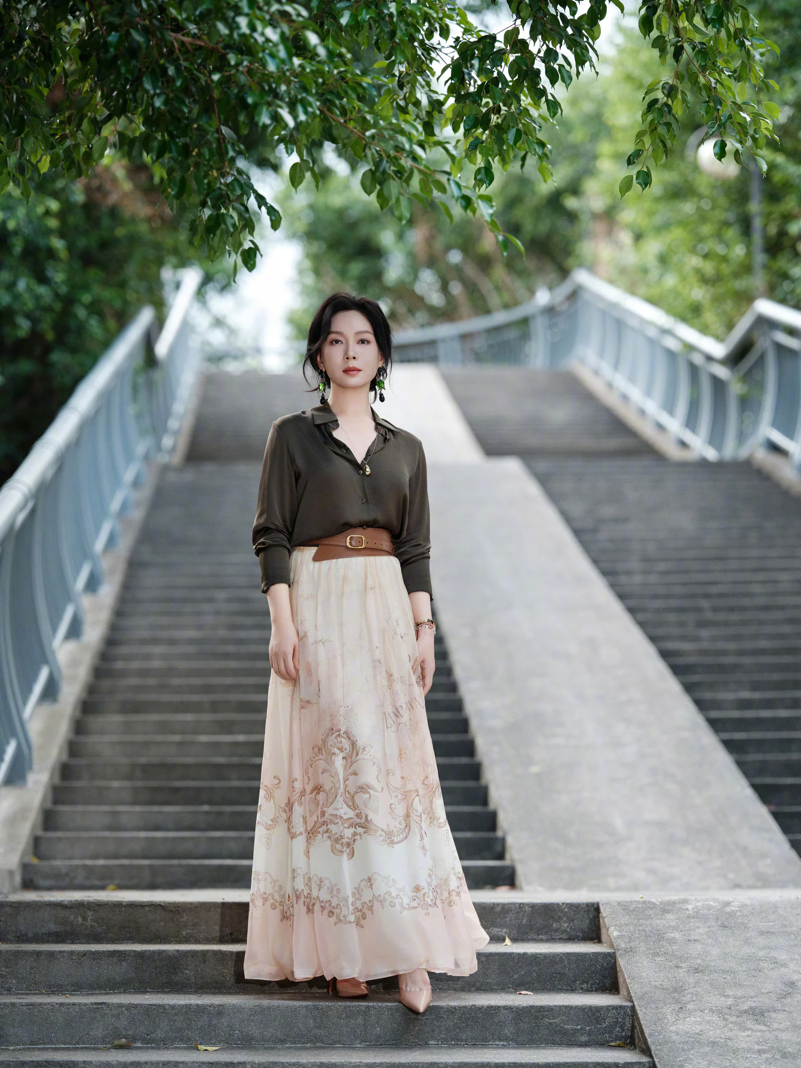 Elegant Earthy Blouse Paired with Bohemian Floral Maxi Skirt and Belted Waist