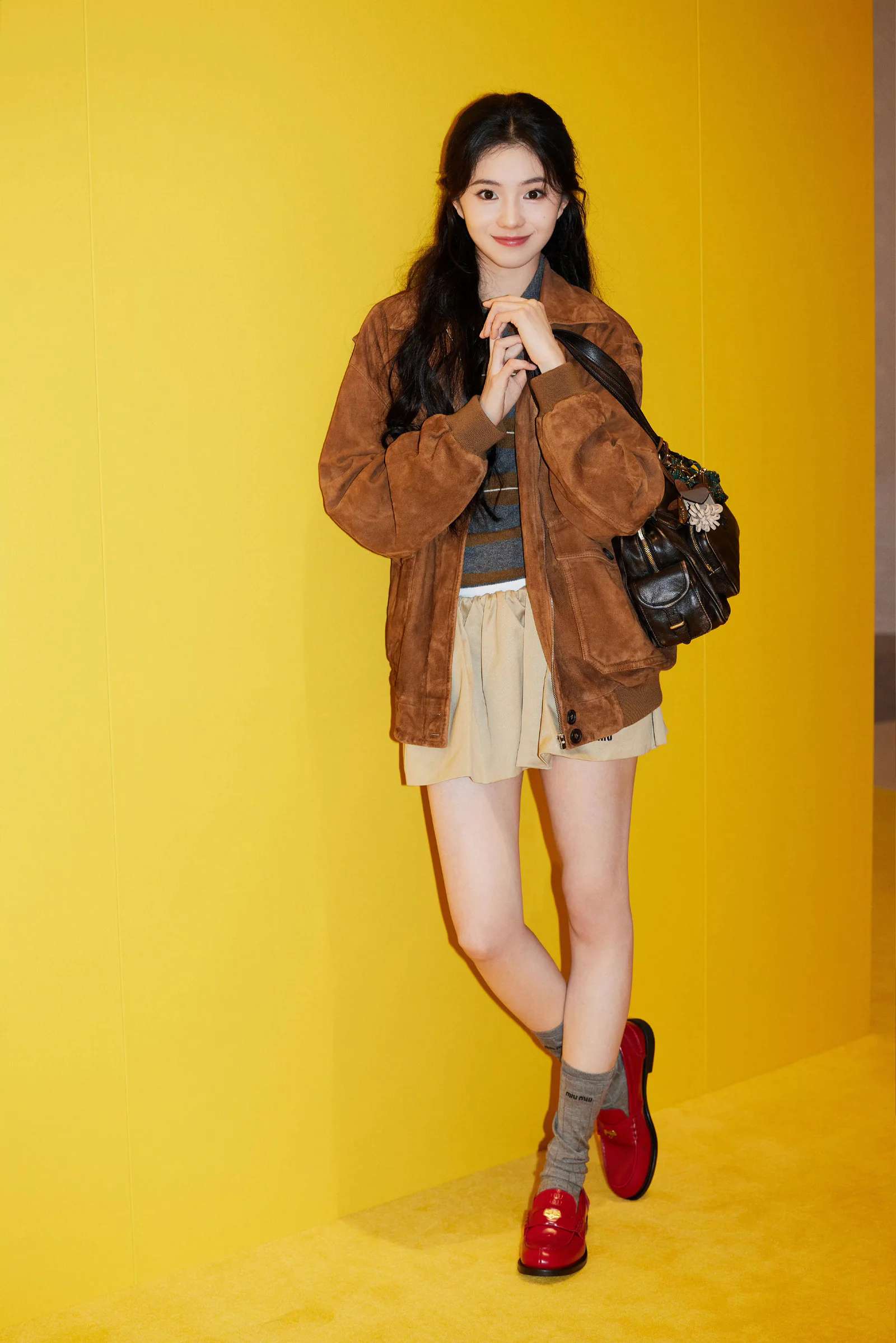 Casual Chic: Brown Suede Jacket with Beige Skirt and Burgundy Shoes