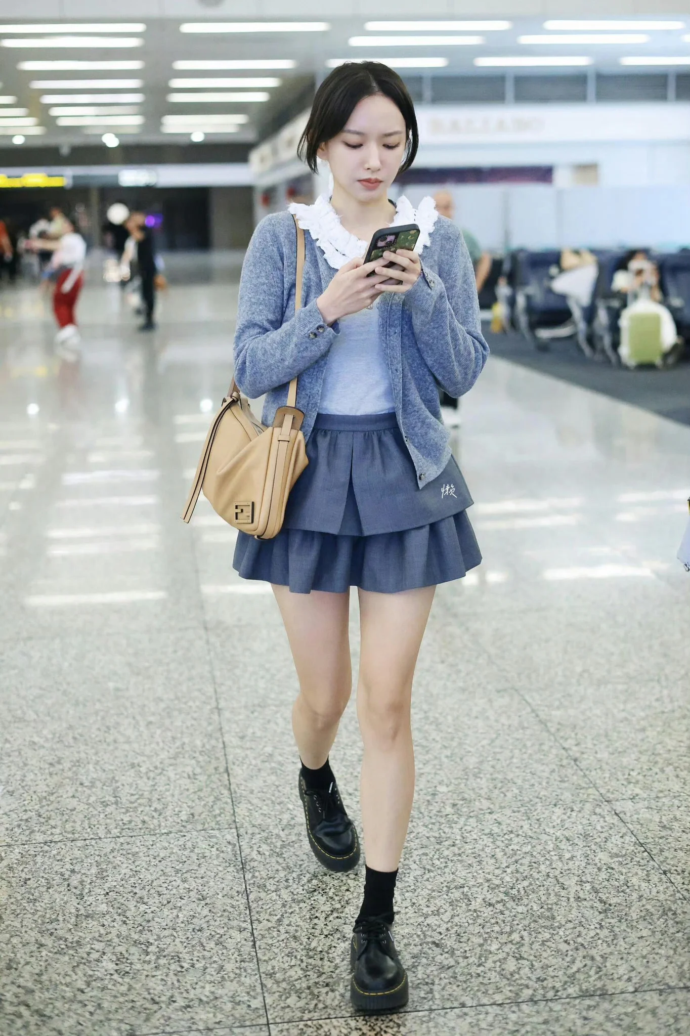Casual Chic in Blue: Layered Cardigan and Pleated Skirt Ensemble with Classic Accessories