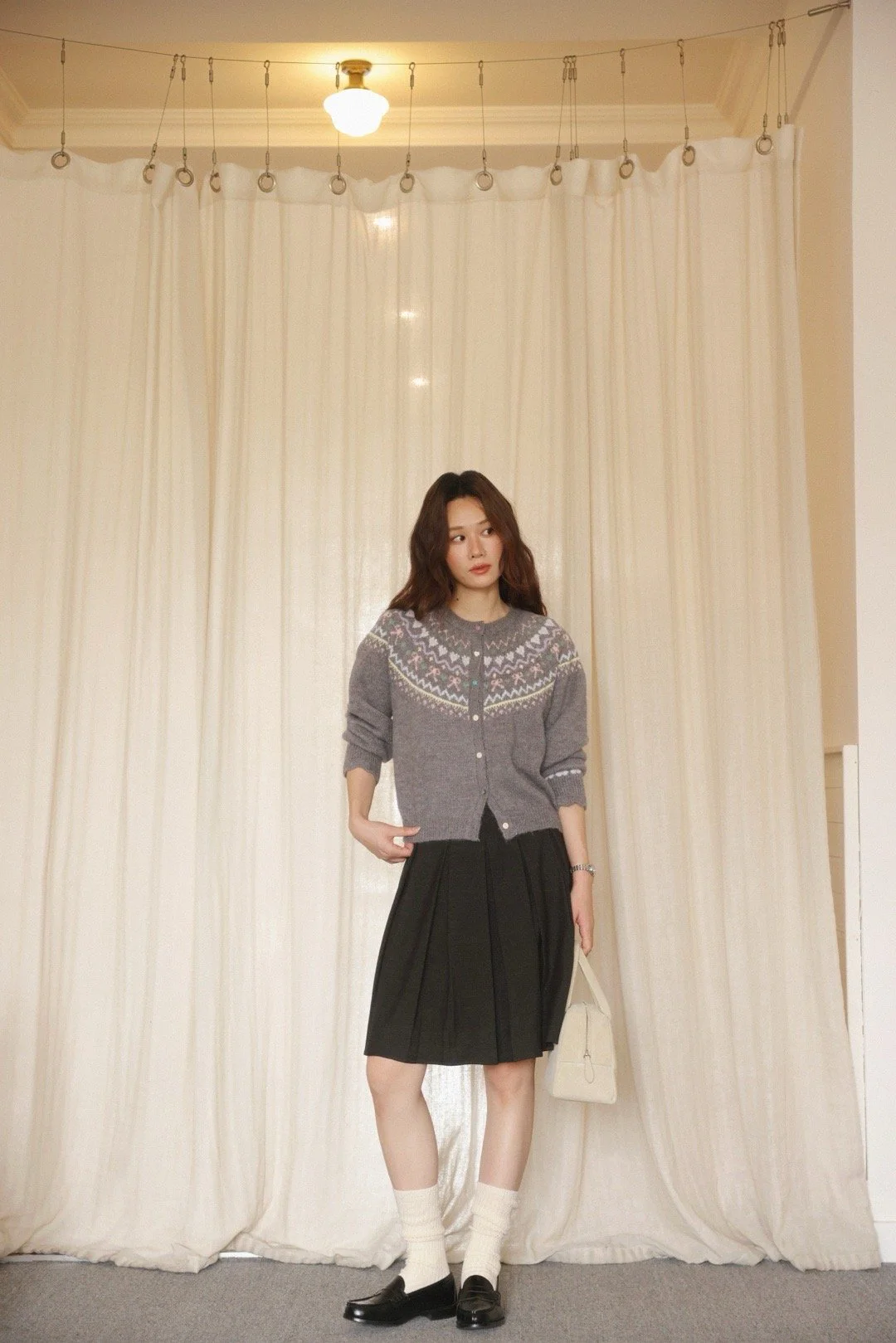 Vintage-Inspired Knit Cardigan and Pleated Skirt with Loafers
