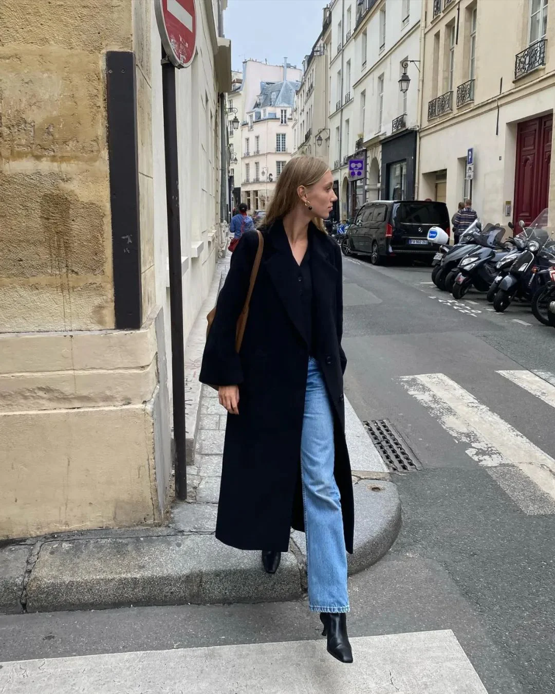 Timeless Black Coat with Casual Blue Jeans and Ankle Boots for Urban Chic