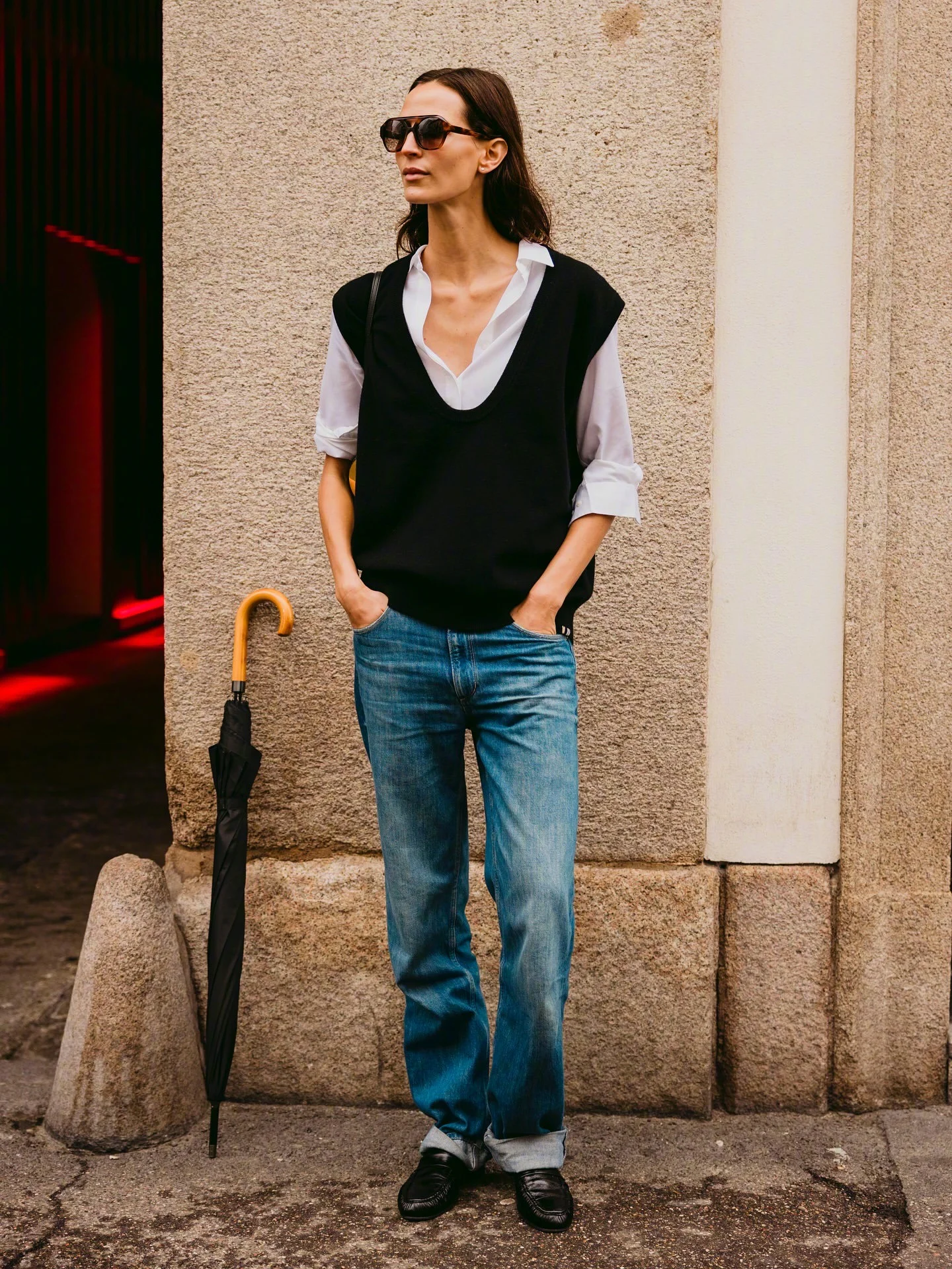 Effortless Style with a Black Sweater and Blue Jeans Ensemble