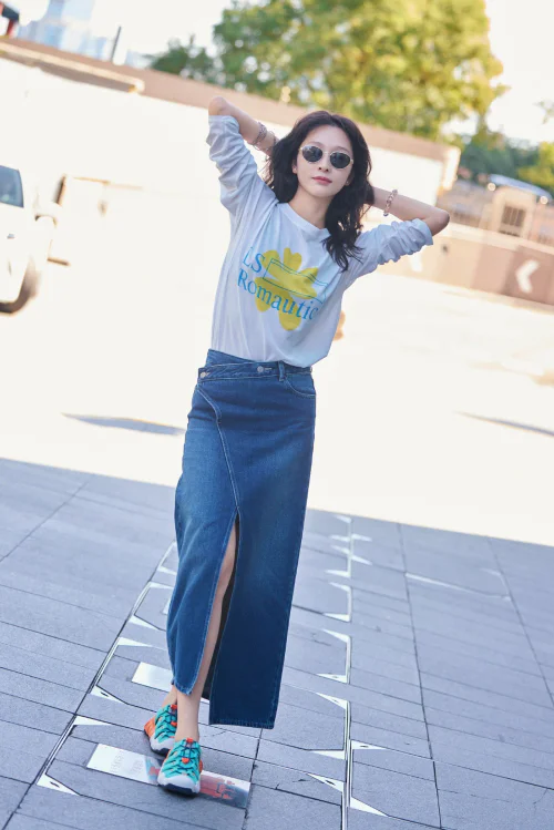 Casual Chic with Graphic Tee and Denim Skirt Accentuated by Colorful Sneakers