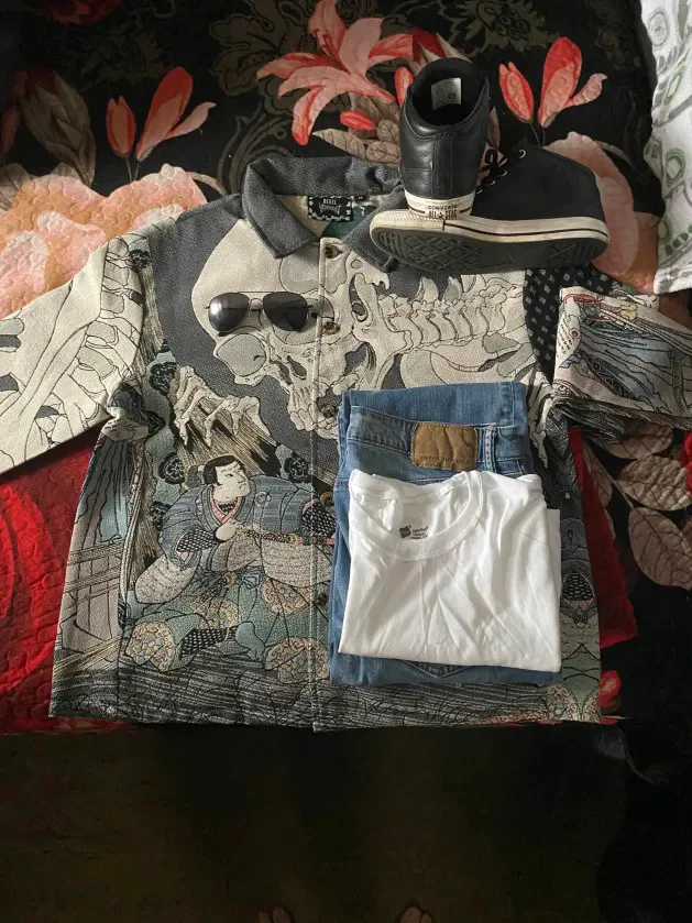 Bold Artistic Jacket with Casual Blue Jeans and White Tee