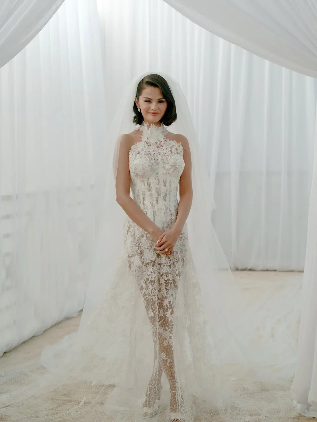 Selena Gomez's Wedding Dress. Exquisite Lace Bridal Gown with High Neckline and Elegant Train