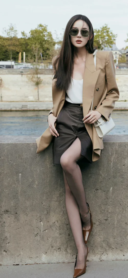 Chic Sophistication in Camel Blazer and Leather Skirt with Elegant Accessories