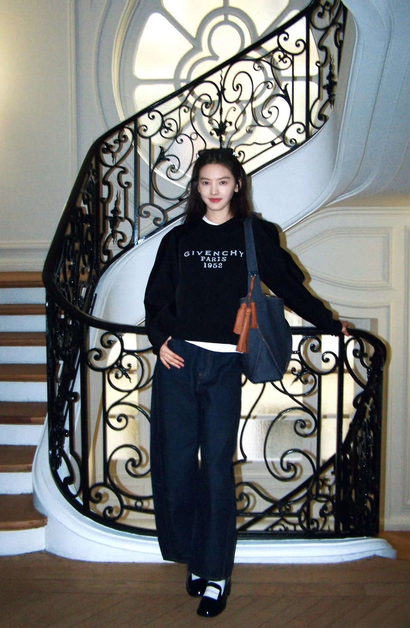 Casual Chic in Black Givenchy Sweater with Relaxed Jeans and Stylish Accessories