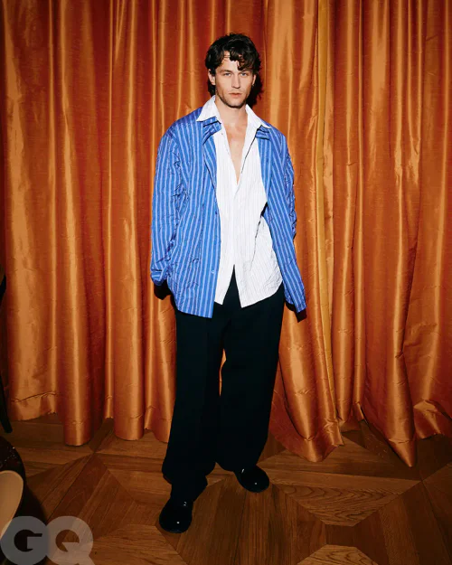 Bold Blue Striped Layering with Wide-legged Black Trousers for a Casual Sophistication