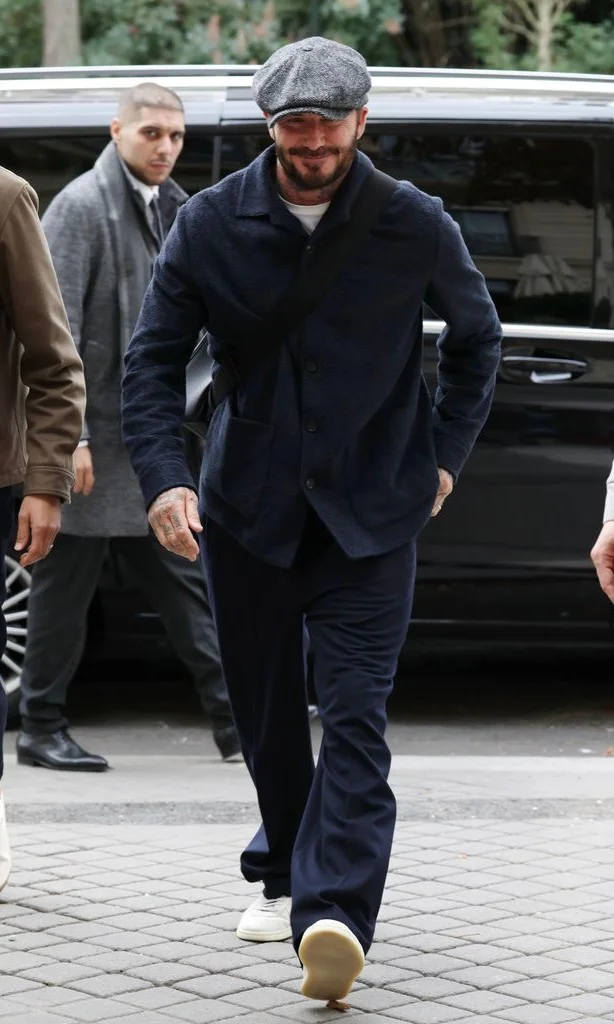Classic Navy Ensemble with Vintage Accents and Modern Sneakers