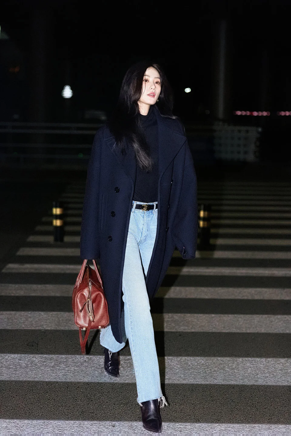 Elegant Navy Overcoat with Casual Denim and Accessories for a Chic Evening Look