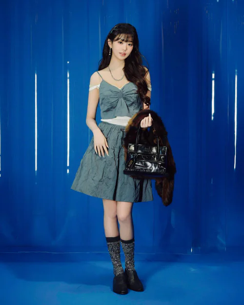 Jang Won-young OOTD. Elegant Meets Whimsical: Bow Top and Skirt with Sparkle Socks