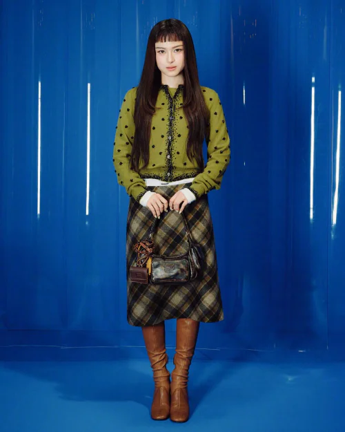 Chic Green Cardigan with Plaid Skirt and Brown Leather Boots