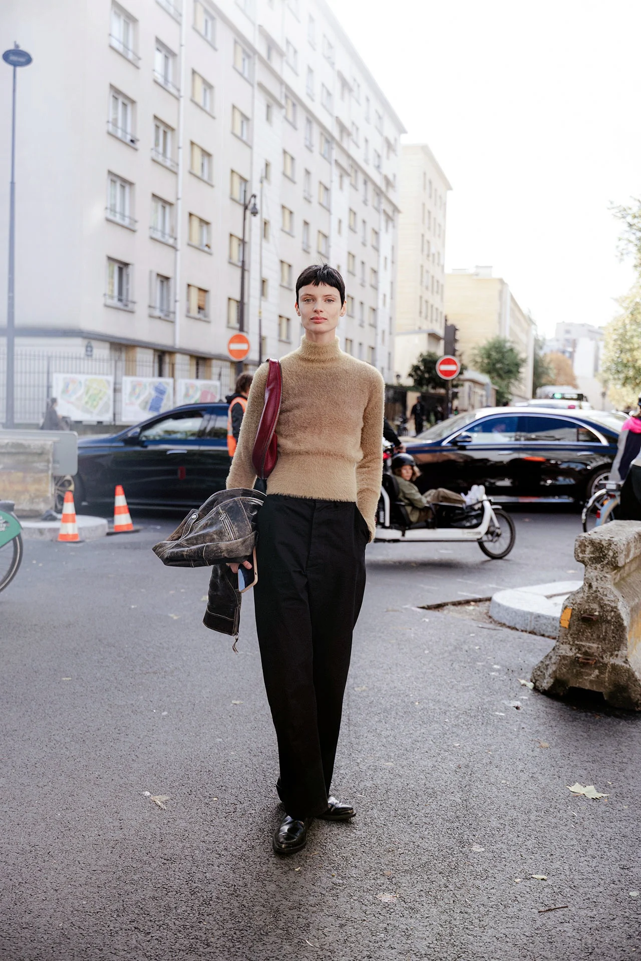 Timeless Minimalism with Camel Sweater and Black Trousers