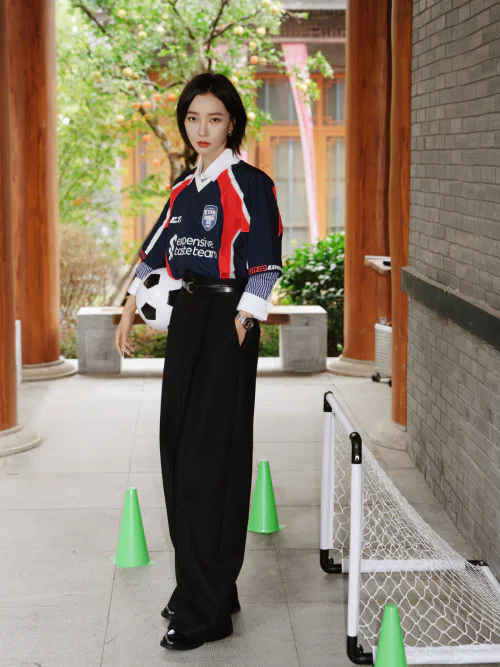 Sporty Chic: Football Jersey and Black High-Waisted Trousers for a Bold Statement