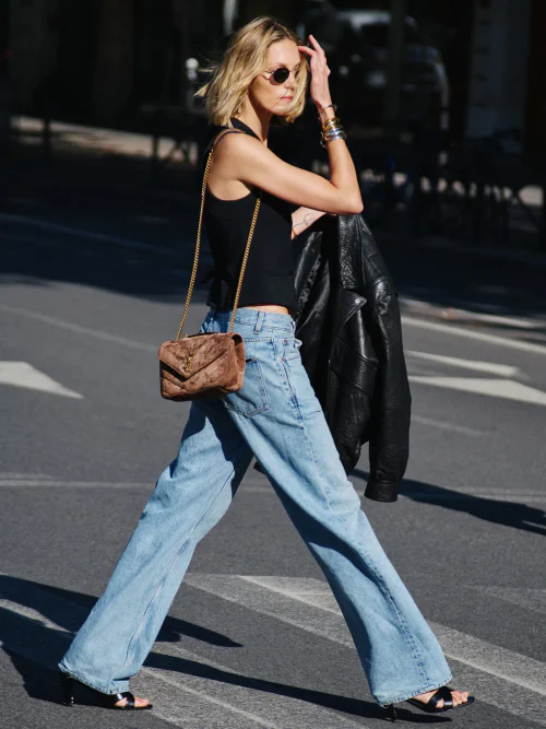Sleek Black Top with Wide-Leg Jeans and Elegant Accessories for City Style