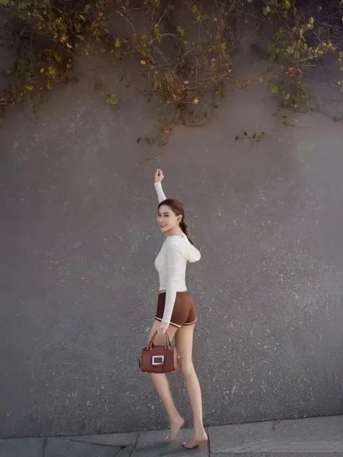 Elegant Neutral Ensemble with Turtleneck and Leather Shorts for a Chic Look