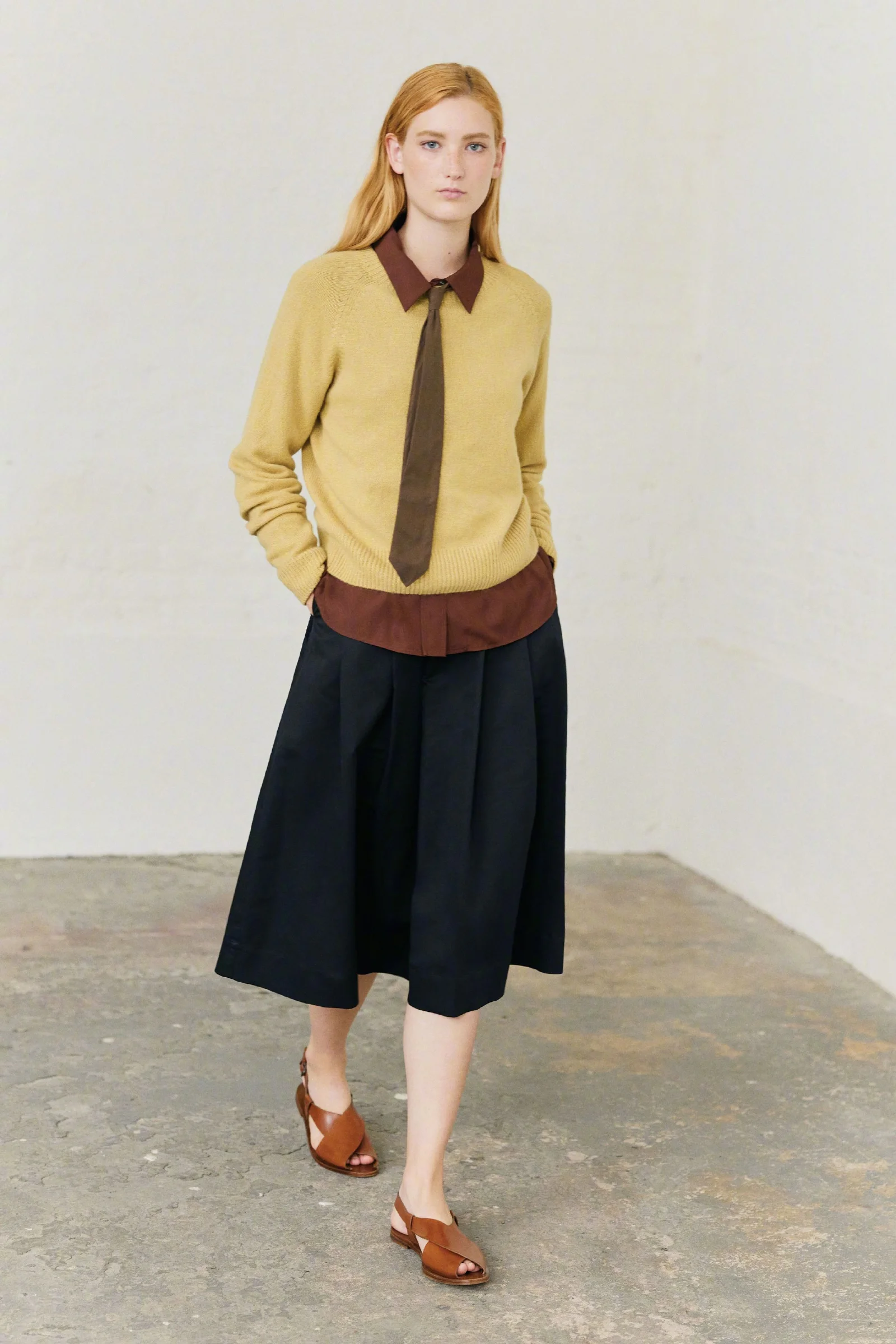 Mustard Sweater with Brown Accents and Navy A-Line Skirt for a Classic Look