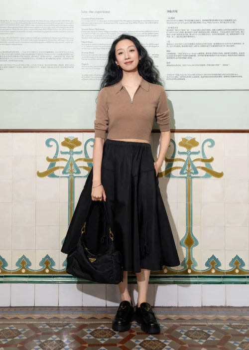 Chic Neutral Tones: Camel Top and Black Midi Skirt with Loafers