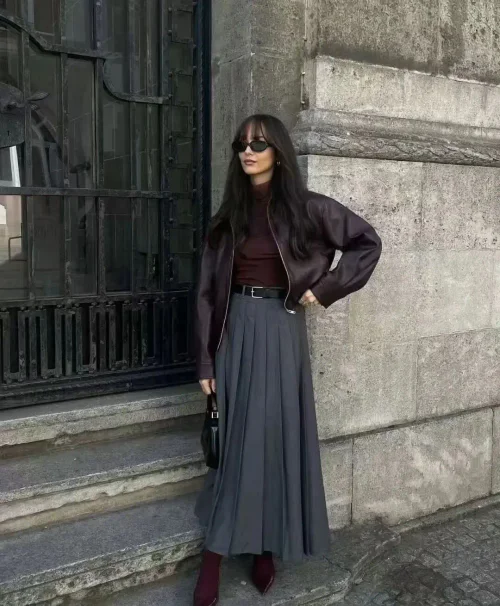 Elegant Burgundies and Grays: Leather Jacket with Pleated Midi Skirt
