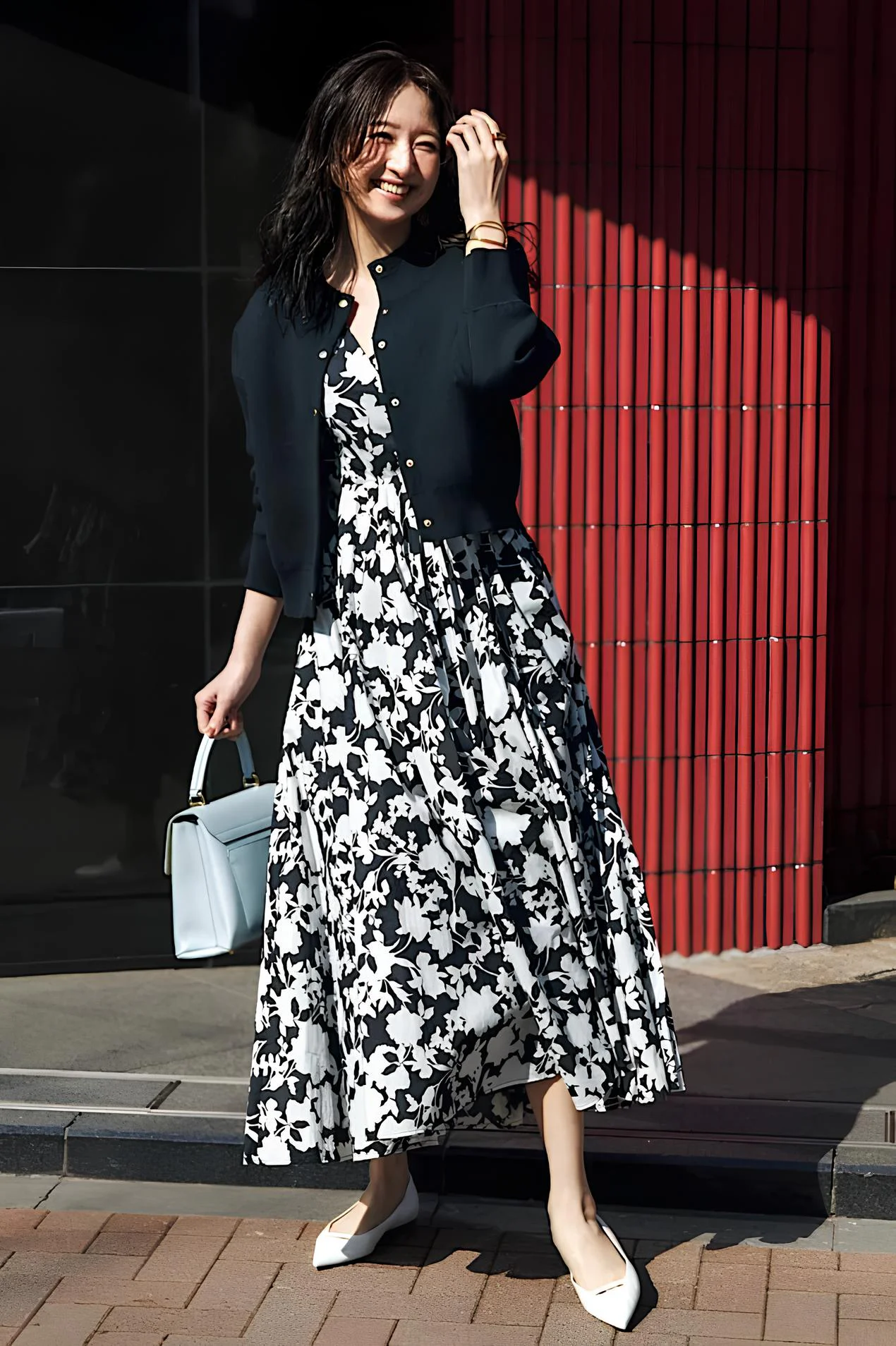 Autumn Outfits: Elegant Black and White Floral Dress with Cardigan and Light Blue Handbag