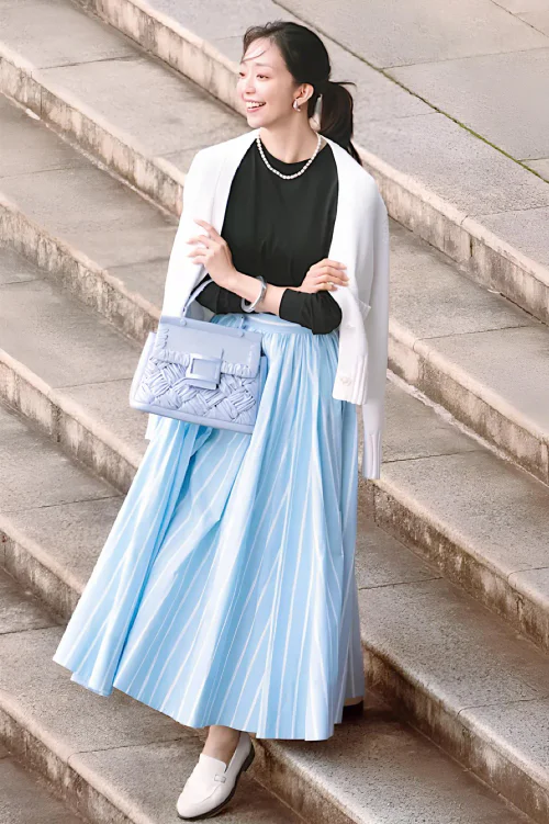 Elegant Spring Outfit with Light Blue Skirt and White Jacket for a Casual Chic Look