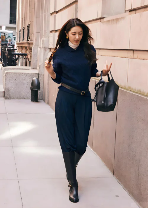 Elegant Monochrome Look with Navy Sweater, Trousers, and Black Accessories