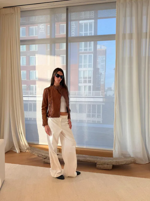Vittoria Ceretti OOTD. Effortless Sophistication with Brown Jacket and White Ensemble