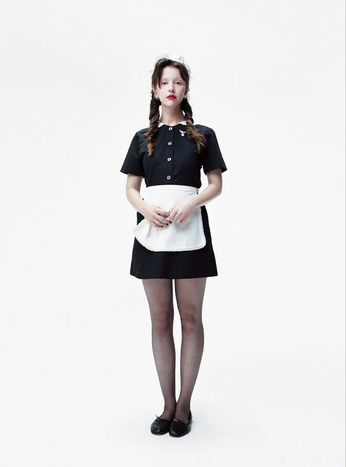 Mia Goth for ELLE. Timeless Black and White Maid-Inspired Outfit with Classic Flair