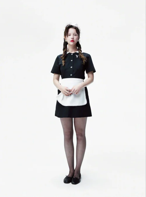 Mia Goth for ELLE. Timeless Black and White Maid-Inspired Outfit with Classic Flair