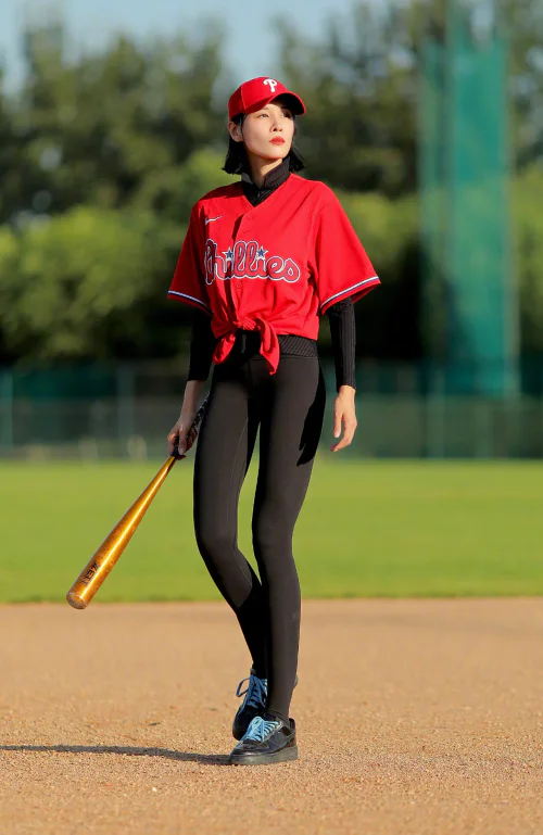 Sporty Baseball Chic: Red Jersey with Black Leggings and Matching Cap