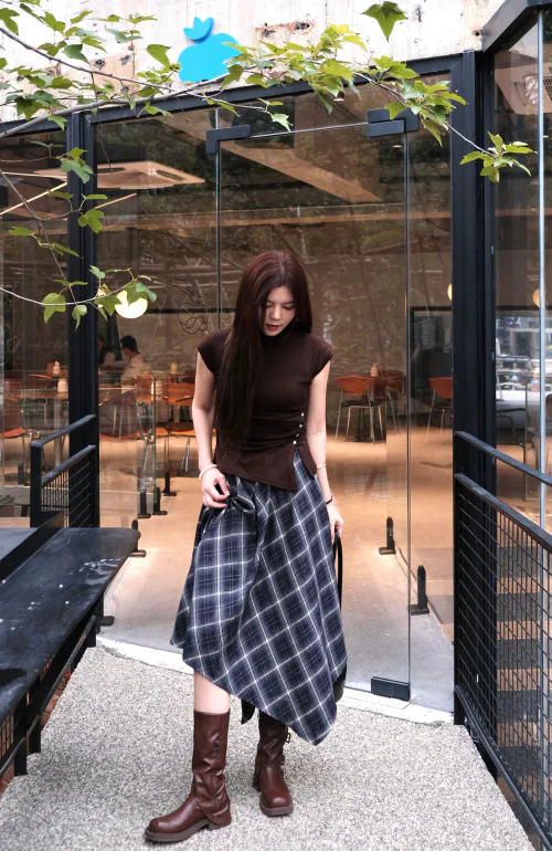 Modern Assymetrical Ensemble with Earthy Tones and Plaid Skirt