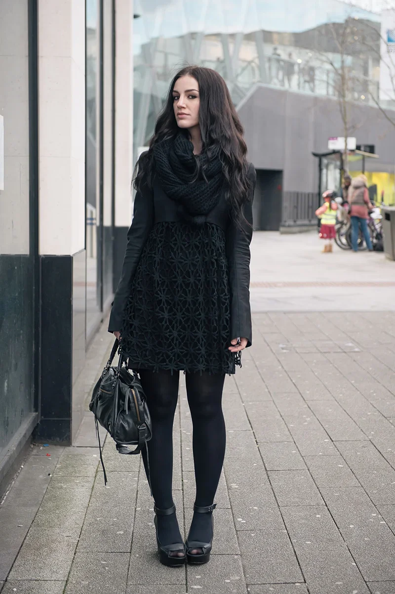Monochrome Chic: Textured Black Dress with Stylish Accessories