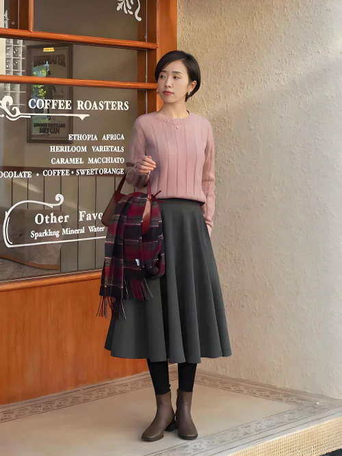 Soft Pink Cable-Knit Sweater with Grey A-Line Skirt and Plaid Accents