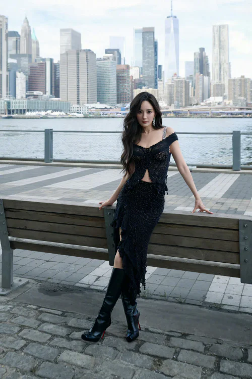 Urban Elegance in Black: Off-Shoulder Dress with Embellished Detailing and High Boots