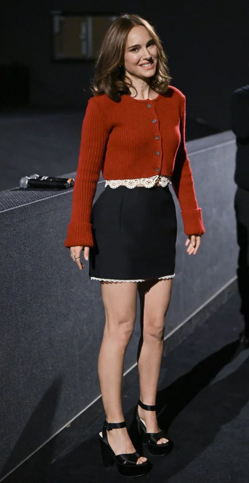 Natalie Portman OOTD. Bold Rust Cardigan and Classic Black Skirt with Lace Detail